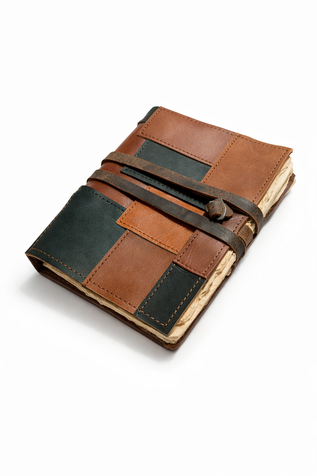 Leather patchwork notebook displayed on wooden desk with pen and coffee.