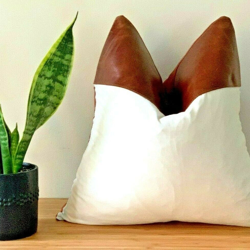 Styled living room look – Mel Leather Co tan leather & canvas throw pillow on armchair.